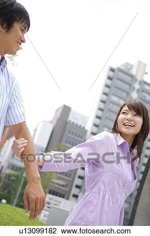 Young Woman Pulling Boyfriend's Arm View Large Photo Image Stock Image - Young Woman Pulling Boyfriend's Arm. Fotosearch