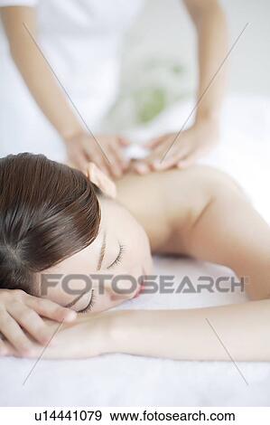 Young Woman Receiving Massage View Large Photo Image Stock Photo - Young Woman Receiving Massage. Fotosearch