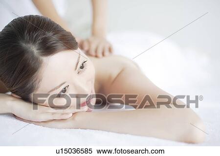 Stock Photography - Young Woman Receiving Massage. Fotosearch