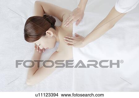 Picture - Young Woman Receiving Massaging. Fotosearch