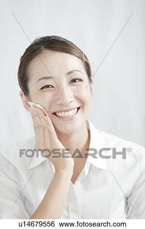 Young woman removing make-up, Tokyo Prefecture, Japan View Large Photo Image Stock Photograph - Young woman removing make-up, Tokyo Prefecture, Japan. Fotosearch