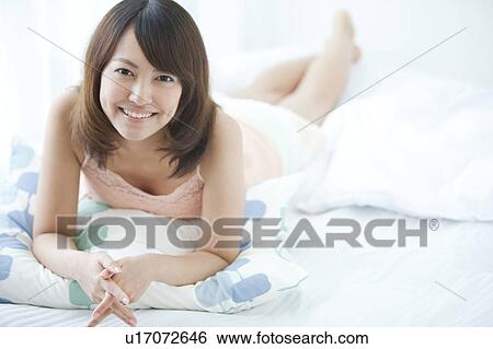 Stock Photograph - Young Woman Smiling. Fotosearch