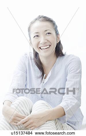 Picture - Young woman smiling, Tokyo Prefecture, Japan. Fotosearch