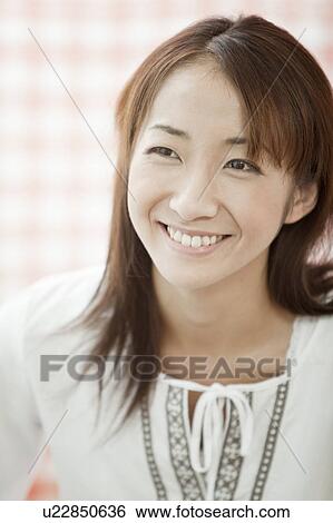Young woman smiling, Tokyo Prefecture, Japan View Large Photo Image Stock Photograph - Young woman smiling, Tokyo Prefecture, Japan. Fotosearch