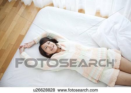 Young Woman Stretching in Bed View Large Photo Image Stock Photo - Young Woman Stretching in Bed. Fotosearch
