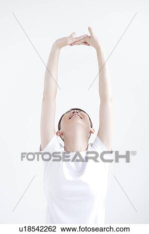 Stock Image - Young Woman Stretching. Fotosearch