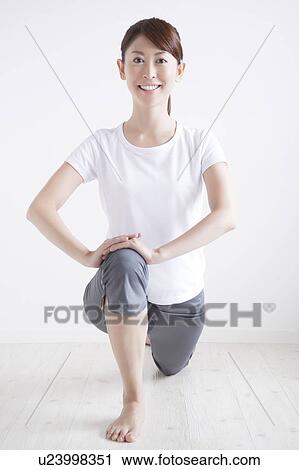 Stock Image - Young Woman Stretching. Fotosearch