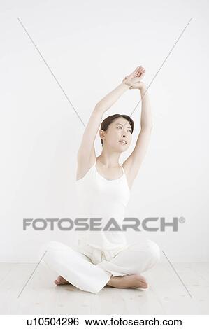 Stock Photograph - Young Woman Stretching. Fotosearch