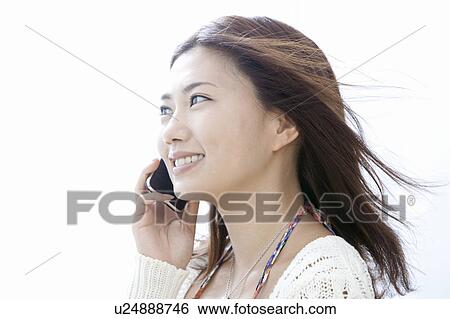 Young woman talking on smart phone, Tokyo Prefecture, Honshu, Japan View Large Photo Image Stock Photograph - Young woman talking on smart phone, Tokyo Prefecture, Honshu, Japan. Fotosearch