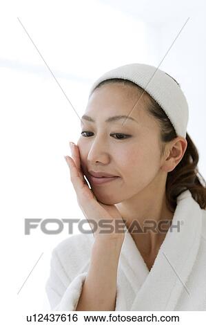 Young Woman Touching Her Face View Large Photo Image Stock Photograph - Young Woman Touching Her Face. Fotosearch