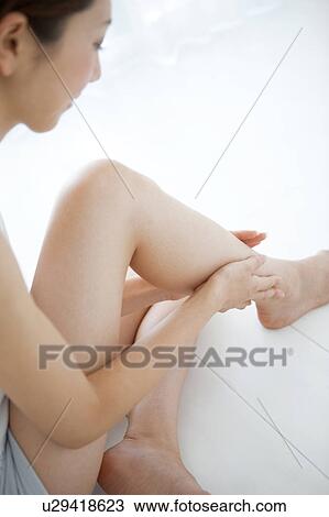 Young Woman Touching Her Leg View Large Photo Image Stock Image - Young Woman Touching Her Leg. Fotosearch