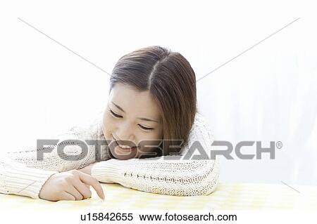 Young woman touching the table, Tokyo Prefecture, Honshu, Japan View Large Photo Image Stock Photography - Young woman touching the table, Tokyo Prefecture, Honshu, Japan. Fotosearch