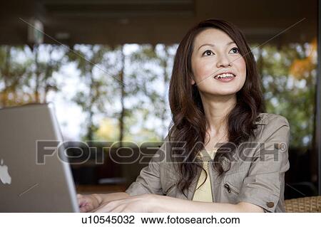 Young Woman Using Laptop View Large Photo Image Stock Image - Young Woman Using Laptop. Fotosearch