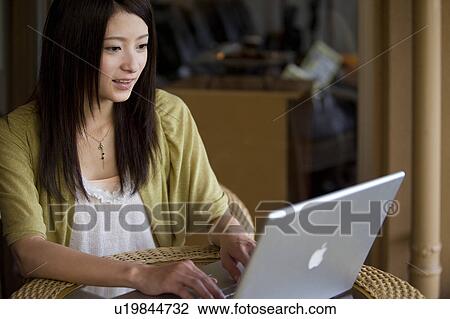 Young Woman Using Laptop View Large Photo Image Stock Image - Young Woman Using Laptop. Fotosearch
