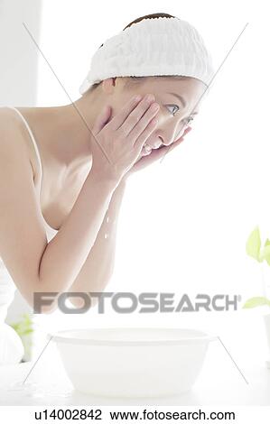 Young Woman Washing Face View Large Photo Image Stock Image - Young Woman Washing Face. Fotosearch