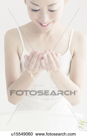 Young Woman Washing Face View Large Photo Image Stock Image - Young Woman Washing Face. Fotosearch