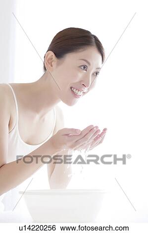 Stock Photograph - Young Woman Washing Face. Fotosearch
