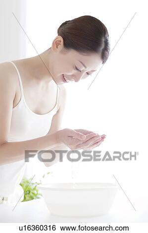 Stock Photograph - Young Woman Washing Face. Fotosearch
