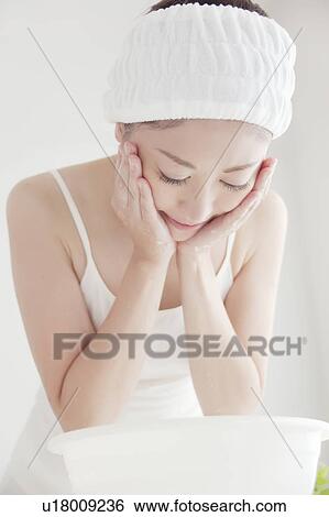 Stock Photograph - Young Woman Washing Face. Fotosearch