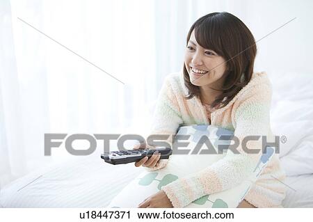 Young Woman Watching TV View Large Photo Image Stock Image - Young Woman Watching TV. Fotosearch