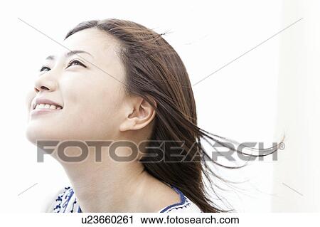 Young woman with hair blowing in the wind, Tokyo Prefecture, Honshu, Japan View Large Photo Image Stock Image - Young woman with hair blowing in the wind, Tokyo Prefecture, Honshu, Japan. Fotosearch