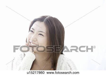 Young woman with hand on chin, Tokyo Prefecture, Honshu, Japan View Large Photo Image Stock Image - Young woman with hand on chin, Tokyo Prefecture, Honshu, Japan. Fotosearch
