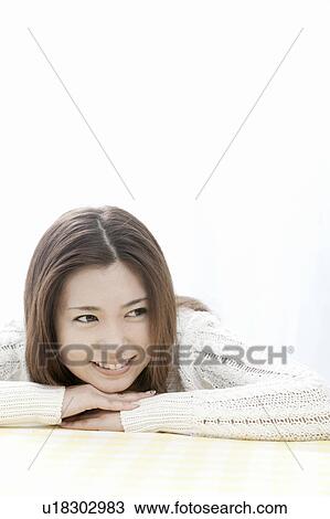 Young woman with head in hands, Tokyo Prefecture, Honshu, Japan View Large Photo Image Stock Image - Young woman with head in hands, Tokyo Prefecture, Honshu, Japan. Fotosearch
