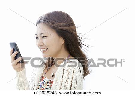 Young woman with smart phone, Tokyo Prefecture, Honshu, Japan View Large Photo Image Stock Image - Young woman with smart phone, Tokyo Prefecture, Honshu, Japan. Fotosearch