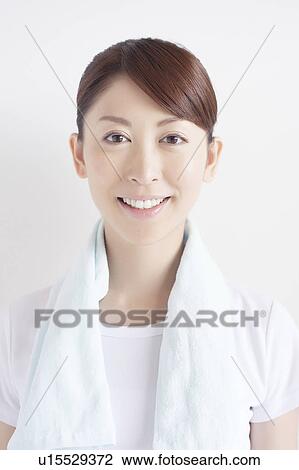 Stock Image - Young Woman with Towel Around Her Neck. Fotosearch