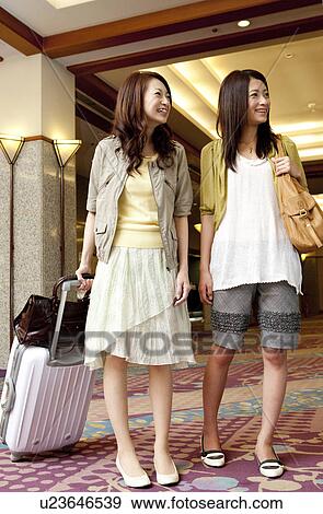 Stock Photo - Young Women Travelling. Fotosearch
