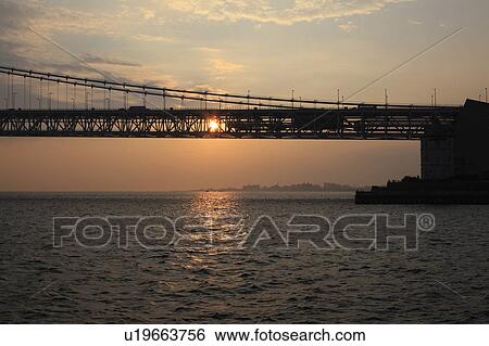 Stock Photograph - Akashi Strait Bridge at dusk, Hyogo Prefecture, Honshu, Japan. Fotosearch