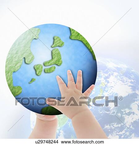 Picture - Baby holding a globe. Fotosearch
