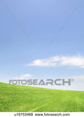 Stock Photo - Blue Sky Over Green Hill. Fotosearch