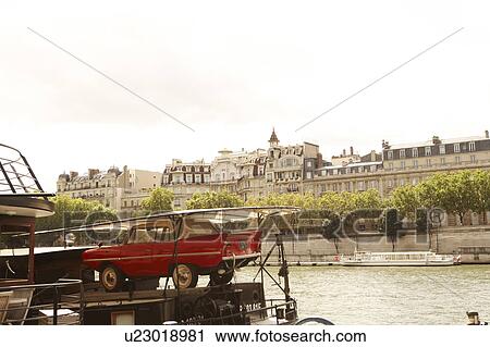 Stock Image - Boat floating on Seine River, Paris, France. Fotosearch