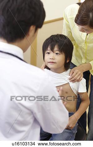 Boy and Mother in Doctor's Office View Large Photo Image Picture - Boy and Mother in Doctor's Office. Fotosearch