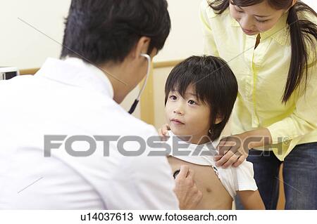 Stock Image - Boy and Mother in Doctor's Office. Fotosearch