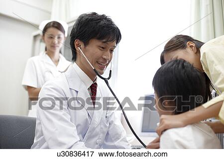 Stock Photo - Boy and Mother in Doctor's Office. Fotosearch