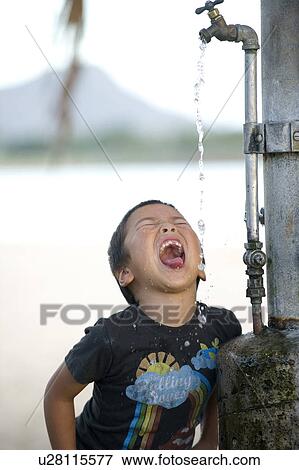 Boy Drinking Water From Faucet View Large Photo Image Stock Photo - Boy Drinking Water From Faucet. Fotosearch