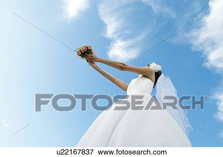 Bride about to throwing a bouquet View Large Photo Image Stock Photo - Bride about to throwing a bouquet. Fotosearch