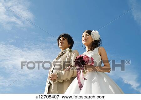 Bride and bridegroom arm in am View Large Photo Image Stock Photo - Bride and bridegroom arm in am. Fotosearch