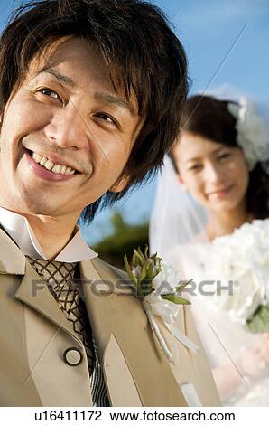 Stock Image - Bride and bridegroom smiling. Fotosearch