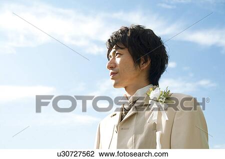Bridegroom standing outdoors View Large Photo Image Stock Image - Bridegroom standing outdoors. Fotosearch