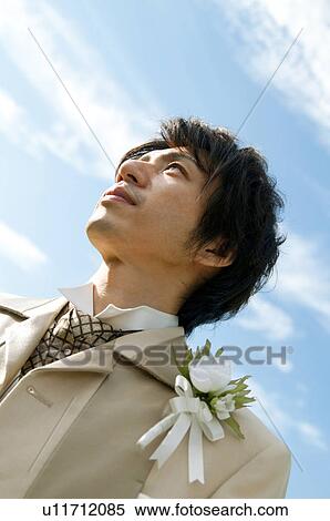 Bridegroom standing outdoors View Large Photo Image Stock Photography - Bridegroom standing outdoors. Fotosearch
