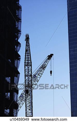 Stock Photo - Building under construction and crane, Chiyoda Ward, Tokyo Prefecture, Honshu, Japan. Fotosearch