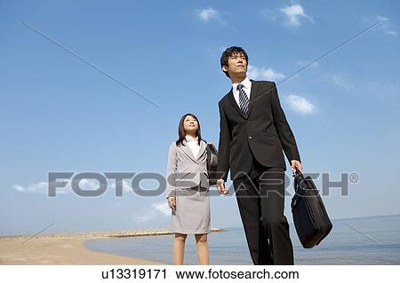 Business people at beach View Large Photo Image Stock Image - Business people at beach . Fotosearch