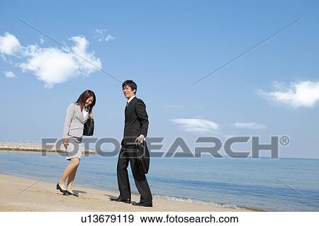 Business people at beach View Large Photo Image Stock Photo - Business people at beach . Fotosearch