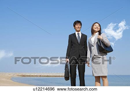 Business people at beach View Large Photo Image Stock Photograph - Business people at beach . Fotosearch