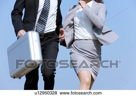 Business people running, midsection View Large Photo Image Stock Photo - Business people running, midsection. Fotosearch