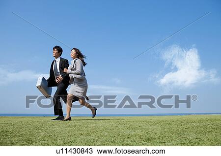 Stock Image - Business people running. Fotosearch
