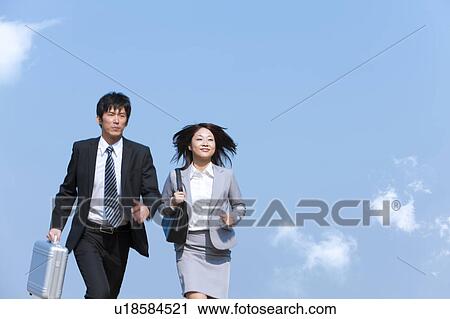 Stock Image - Business people running. Fotosearch